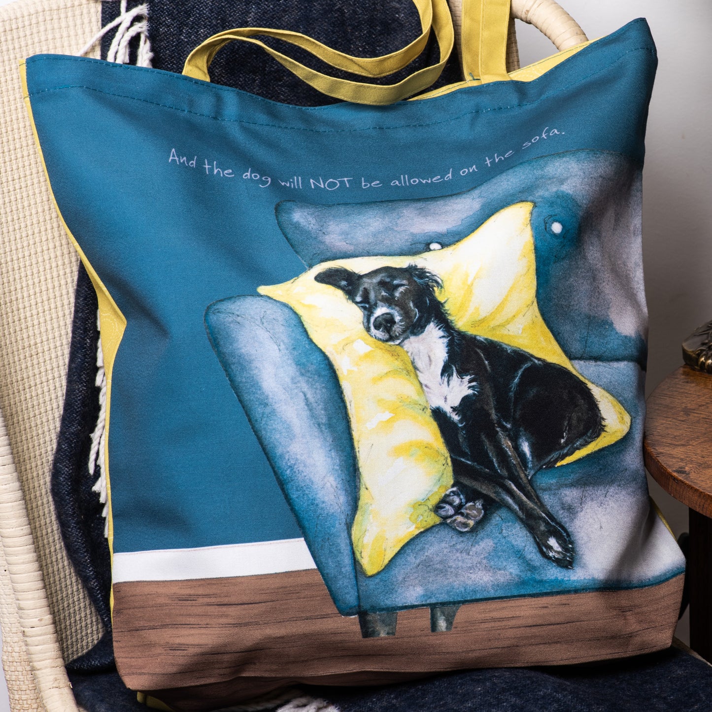 The dog and sofa tote bag